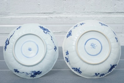 Twelve Chinese blue and white cups and saucers with floral design, Kangxi